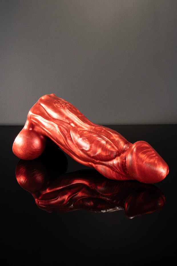 A product photo for a Bael bull dildo in demon blood colouring.