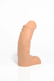 A product photo of a curved dildo in tan colour taken from a side angle.