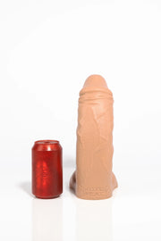 A medium tan curved dildo.