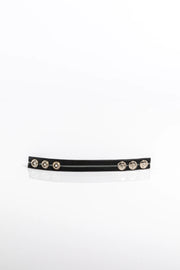 A product photo of a black cock ring with grey trim.