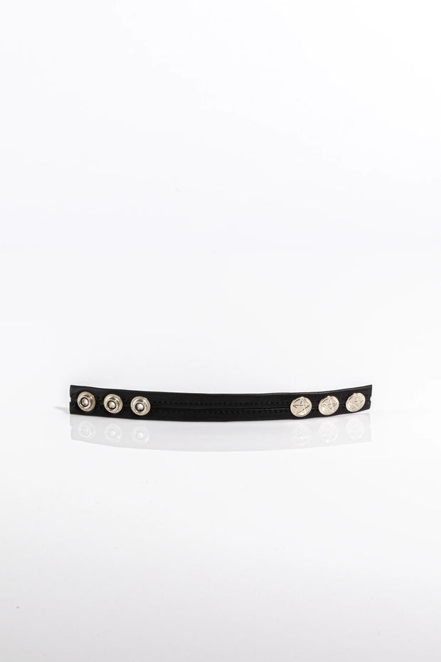 A product photo of a black trimmed black cock ring.