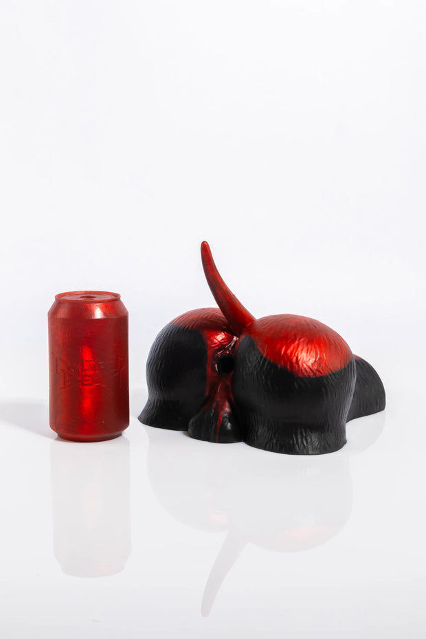 A product photo of a dog fleshlight in patch colour taken from behind.