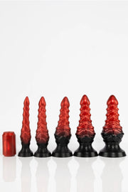 A photo of five Tentacle butt plugs next to each other as a size comparison. 